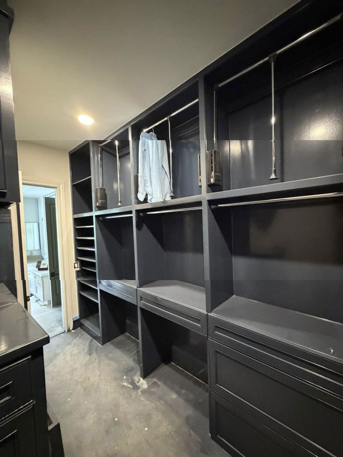 Custom closet cabinetry in dark paint, in progress
