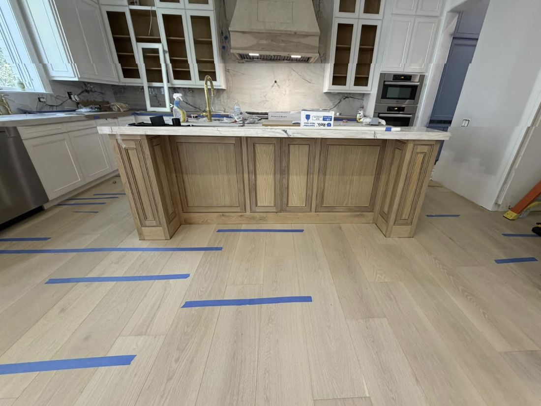 Kitchen island with new wood floors, in progress