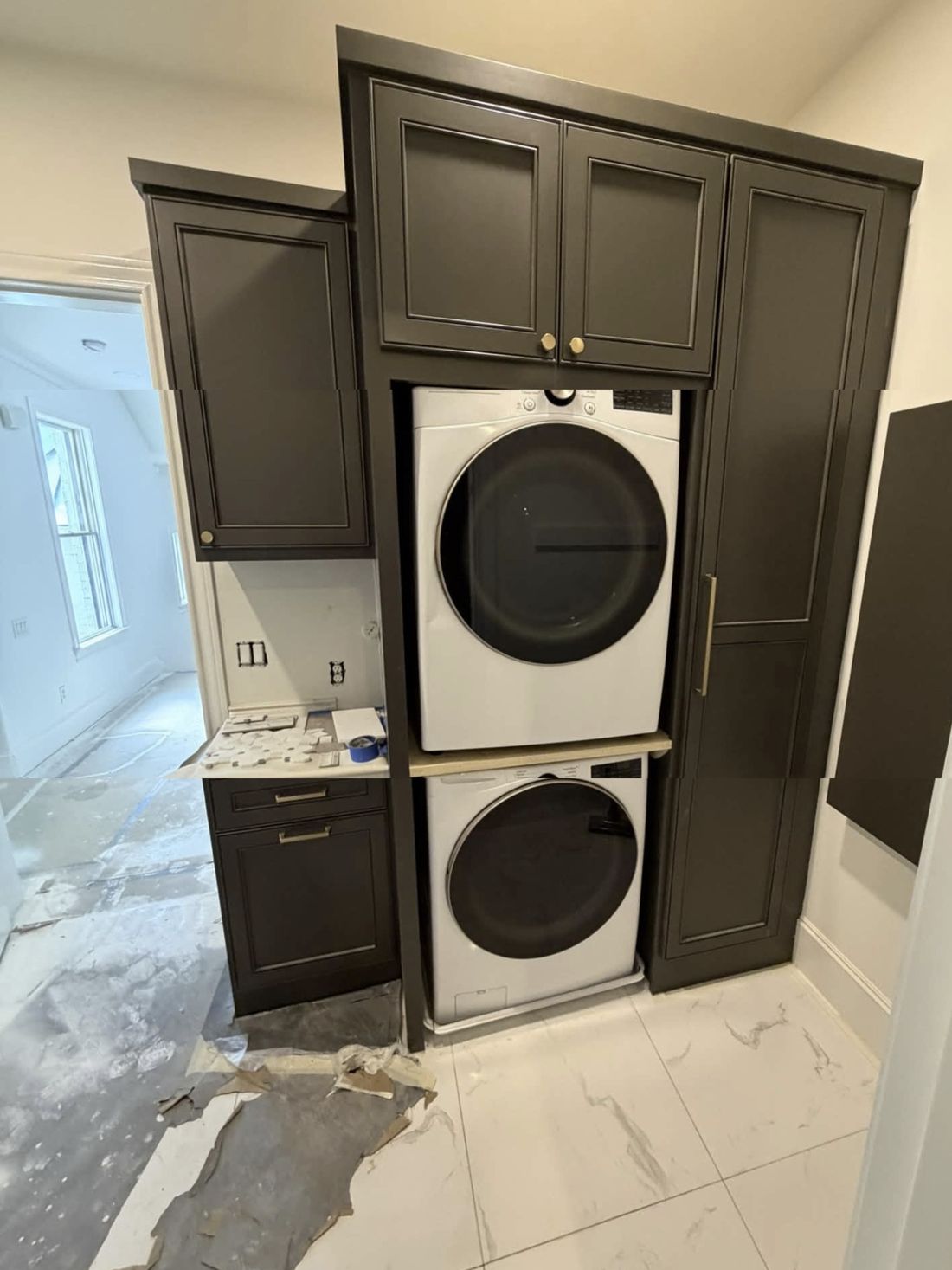 Stacked washer and dryer built into cabinetry